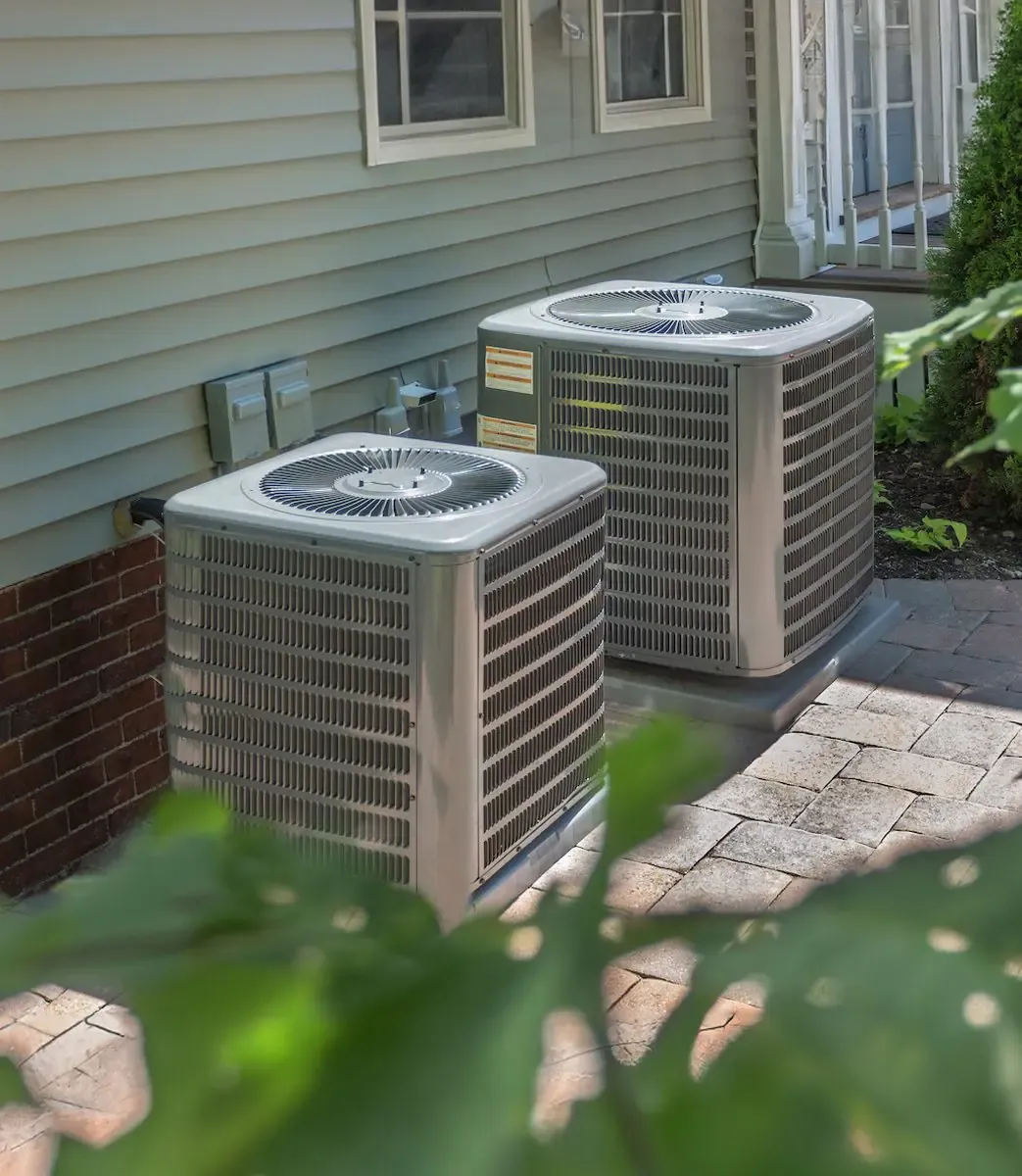 Air-conditioning condenser units beside a Florida home